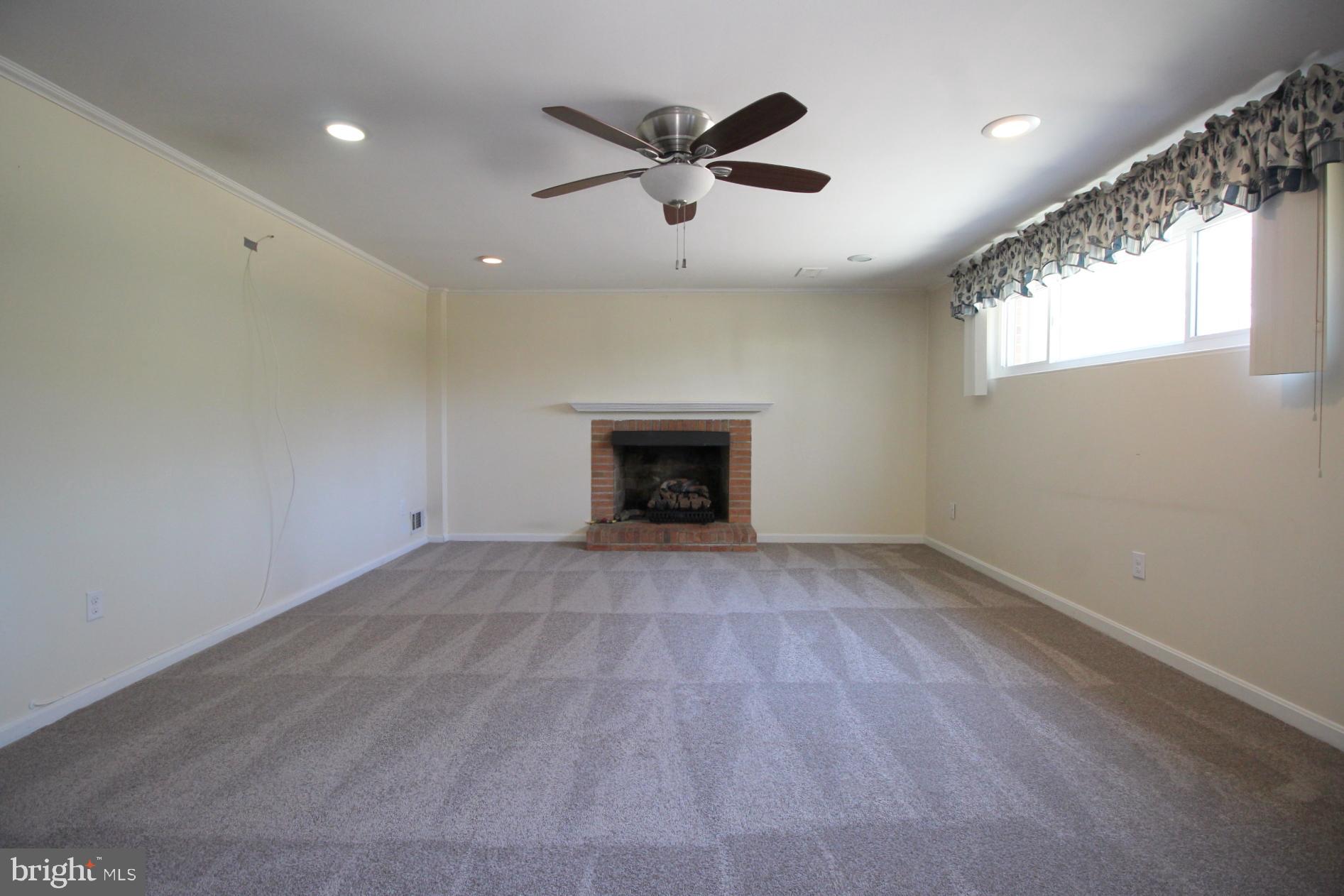8504 Wagon Wheel Road Alexandria, VA 22309 - Photo 19 of 30 an empty room with windows and fireplace