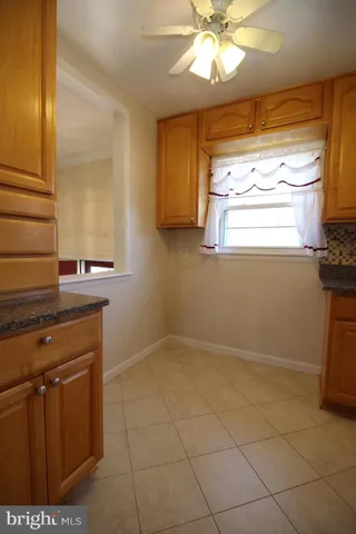 a bathroom with a sink a mirror and a window