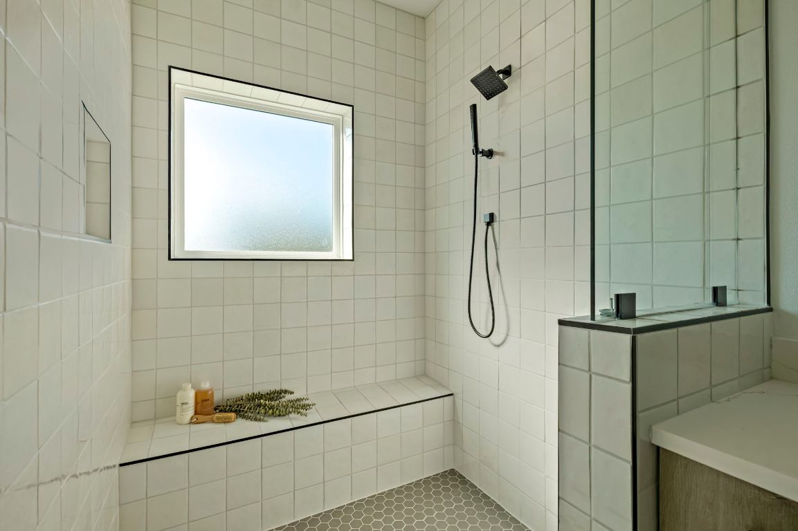 4601 Hank Avenue, Unit 1 Austin, TX 78745 - Photo 25 of 40 Bathroom with walk in shower and tile walls