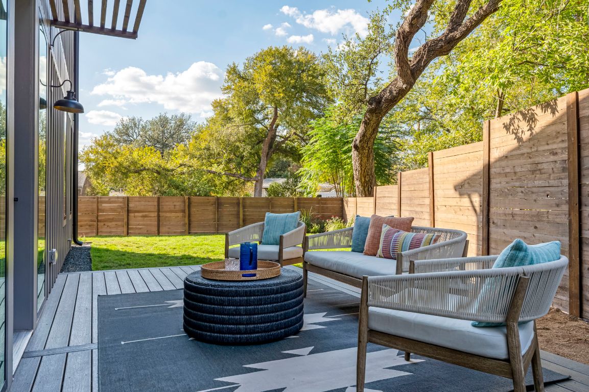 4601 Hank Avenue, Unit 1 Austin, TX 78745 - Photo 33 of 40 Fenced backyard with outdoor lounge area and a patio area