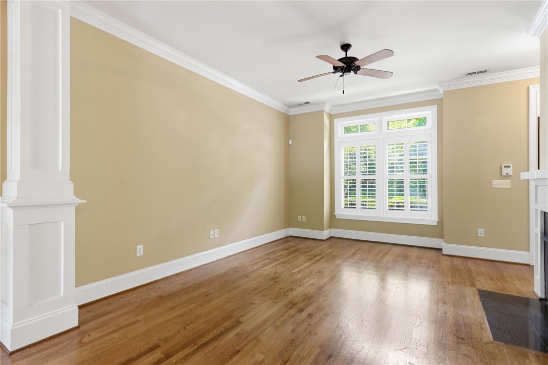 204 Butler Avenue Greenville, SC 29601 - Photo 7 of 26 Hardwood floors and generous natural illumination create an inviting atmosphere.