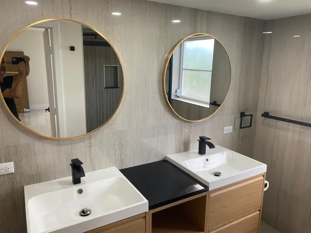 a bathroom with a sink and a mirror