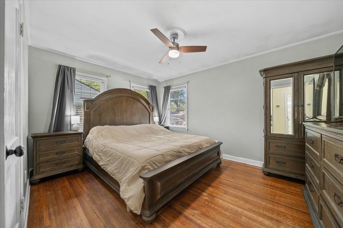 1196 Dearing Road Memphis, TN 38117 - Photo 16 of 27 Spacious primary bedroom with real hardwood floors, ceiling fan and new paint.