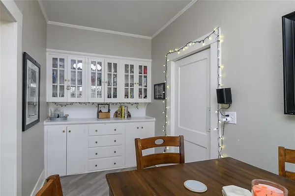 a room with cabinets and wooden floor