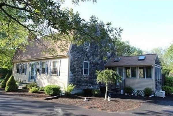 14 Highland Ridge Road Freetown, MA 02702 - Photo 1 of 20 a front view of a house with garden