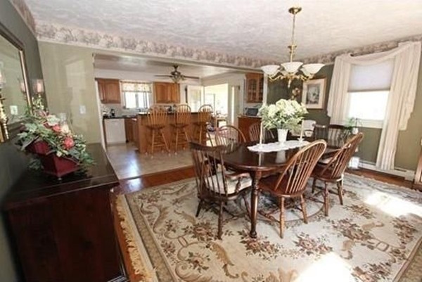 14 Highland Ridge Road Freetown, MA 02702 - Photo 9 of 20 a view of a dining room and livingroom with furniture wooden floor a chandelier