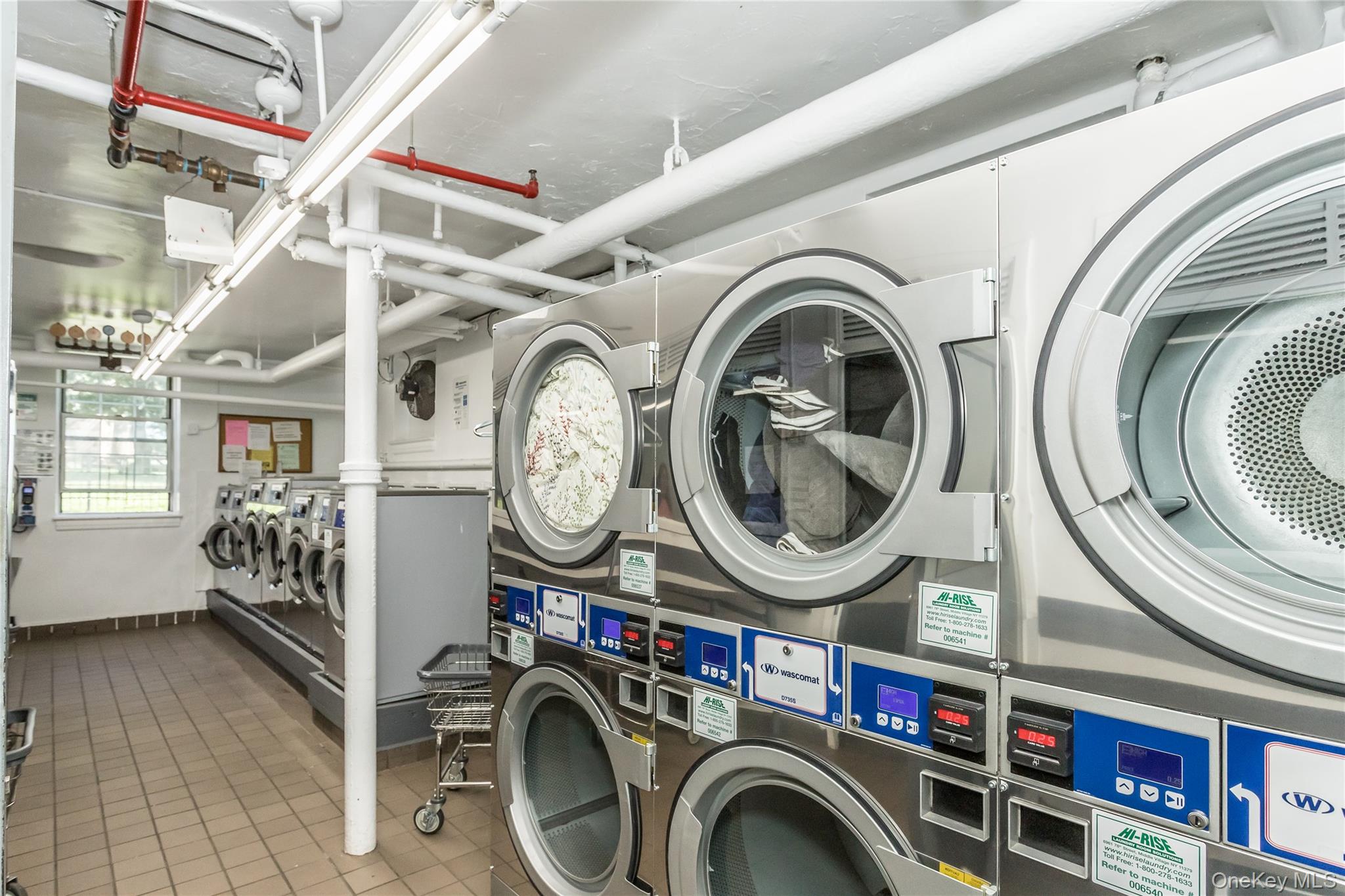 51-28 30th Avenue, Unit 3 Queens, NY 11377 - Photo 14 of 20 Community laundry room with estacked washer and dryer