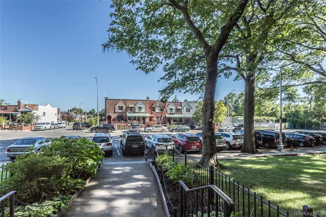 a view of a garden filled with lots of potted plants