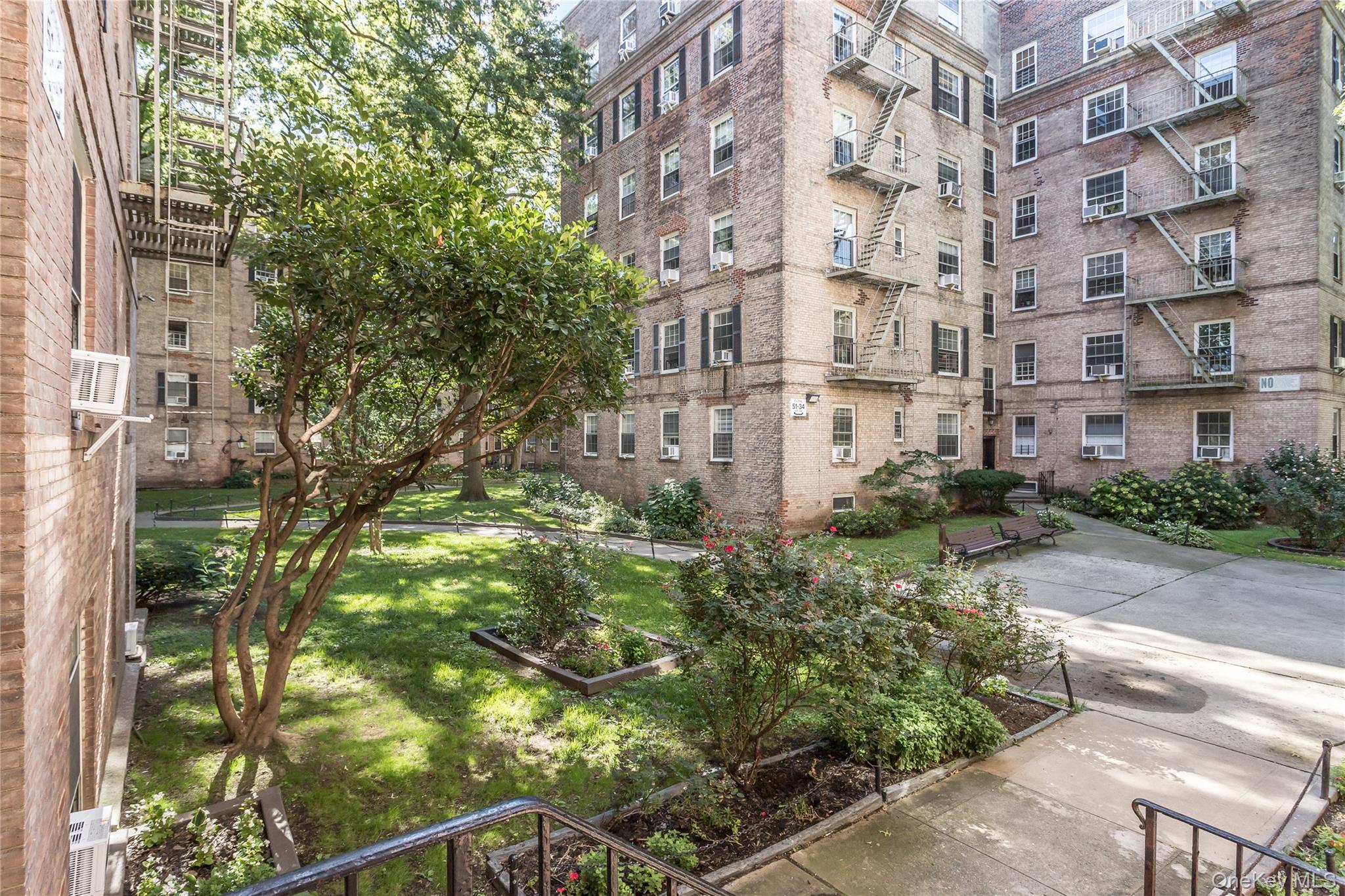 51-28 30th Avenue, Unit 3 Queens, NY 11377 - Photo 2 of 20 View of community featuring a lawn