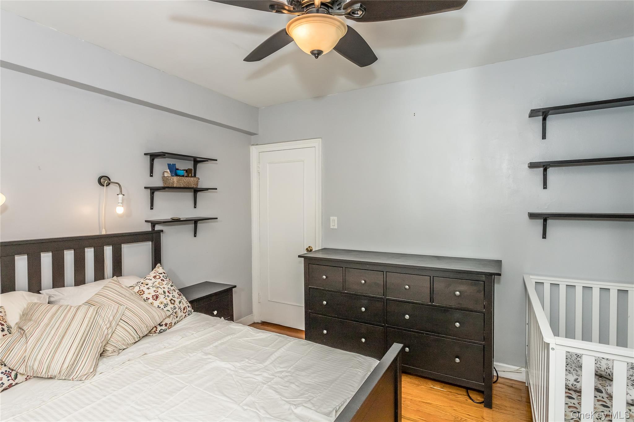51-28 30th Avenue, Unit 3 Queens, NY 11377 - Photo 10 of 20 Bedroom with light wood-style flooring and ceiling fan