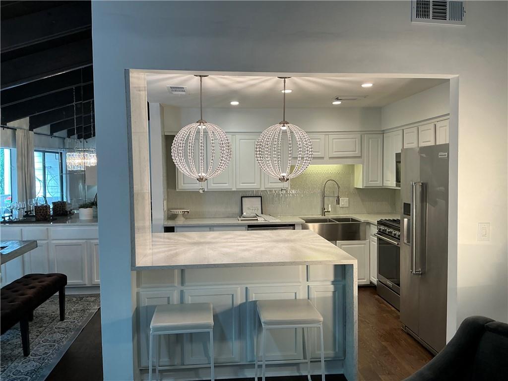 3823 Paces Ferry West Atlanta, GA 30339 - Photo 8 of 33 a kitchen with a sink stainless steel appliances and cabinets