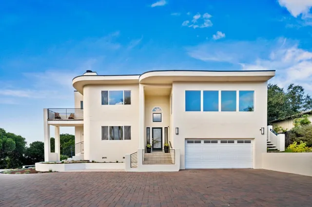 a front view of a house with a garage