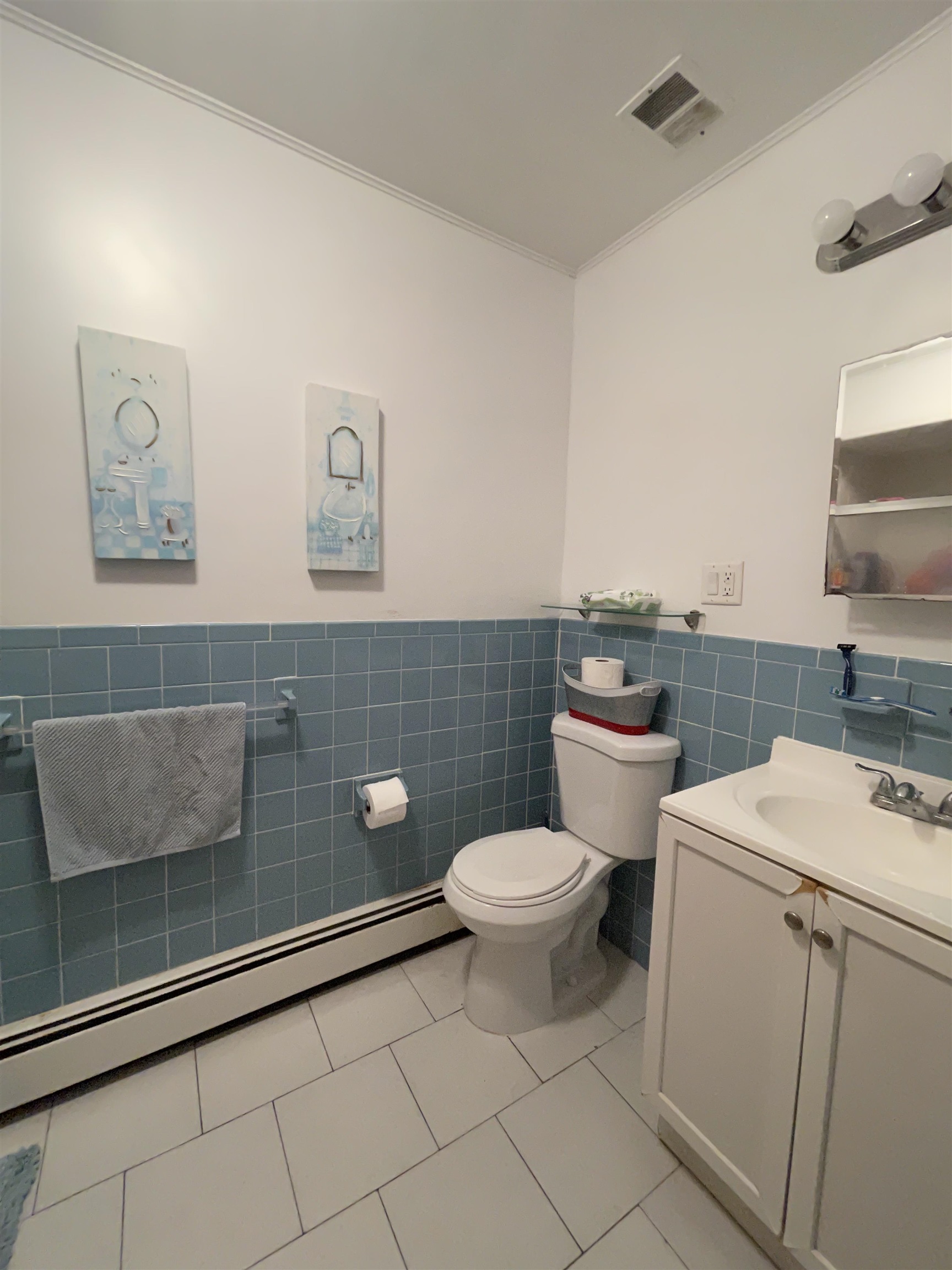 34 Trask Avenue, Unit 2 Bayonne, NJ 07002 - Photo 11 of 11 a bathroom with a toilet a sink and mirror