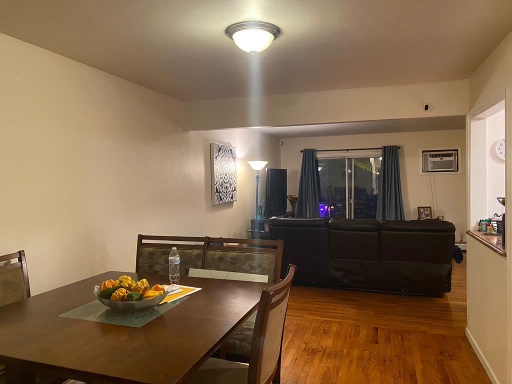 34 Trask Avenue, Unit 2 Bayonne, NJ 07002 - Photo 3 of 11 a living room with furniture and a wooden floor