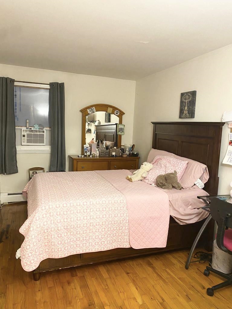 34 Trask Avenue, Unit 2 Bayonne, NJ 07002 - Photo 8 of 11 a bedroom with a bed and window