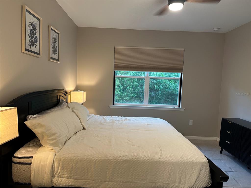 1276 Enbrook Loop Naples, FL 34114 - Photo 13 of 15 a bedroom with a bed and a window
