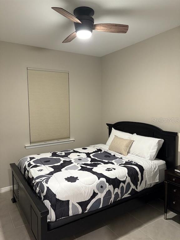 1276 Enbrook Loop Naples, FL 34114 - Photo 10 of 15 a bedroom with a bed and a chandelier