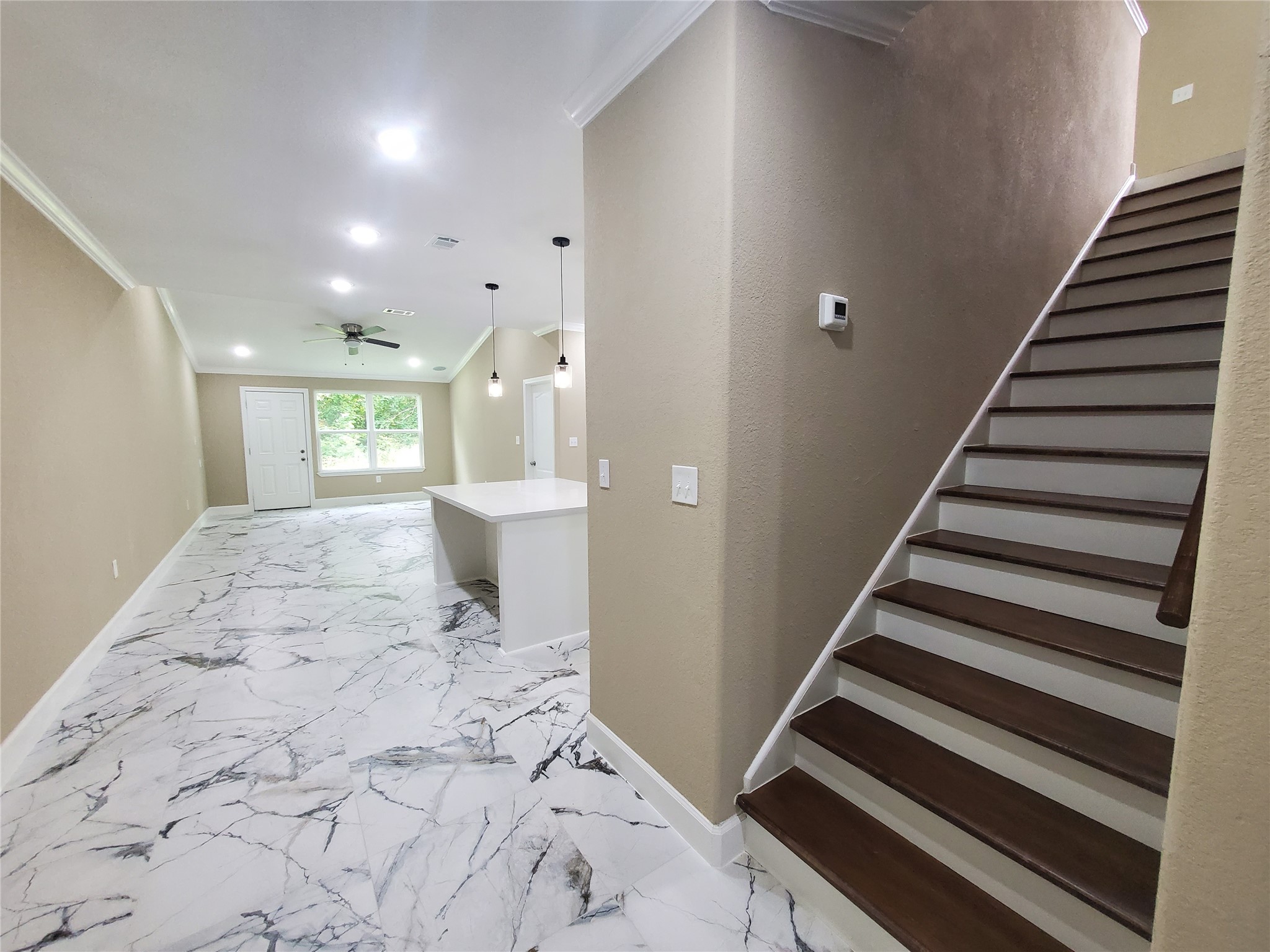 1306 North 9th Street Conroe, TX 77301 - Photo 25 of 47 a view of entryway with wooden floor and stairs