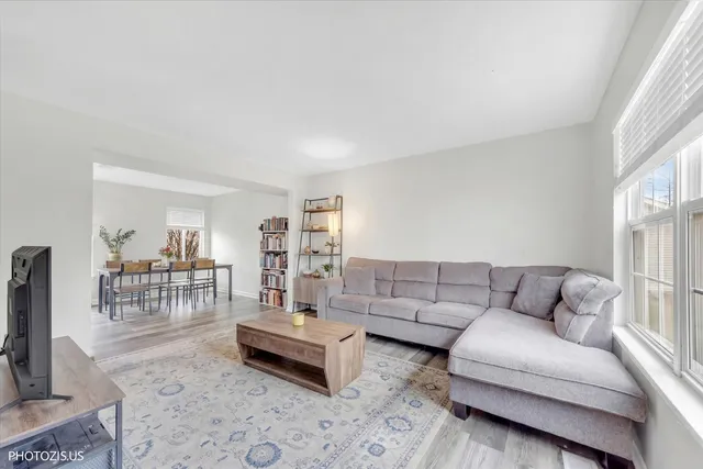a living room with furniture and a table
