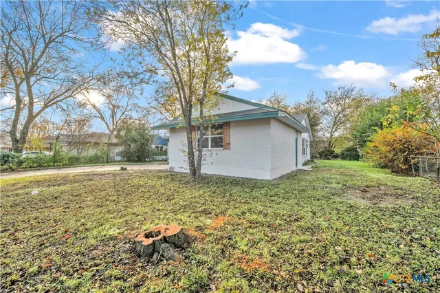 a view of backyard with outdoor space