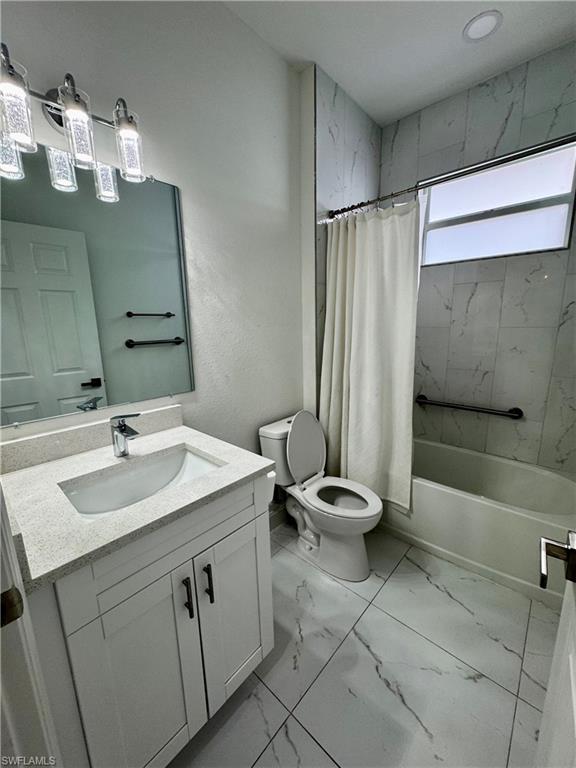 3743 Kenyon Street Fort Myers, FL 33905 - Photo 12 of 18 a bathroom with a sink toilet and shower