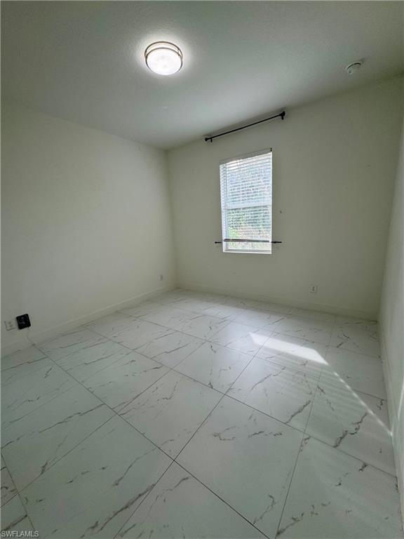 3743 Kenyon Street Fort Myers, FL 33905 - Photo 13 of 18 an empty room with a empty space and window