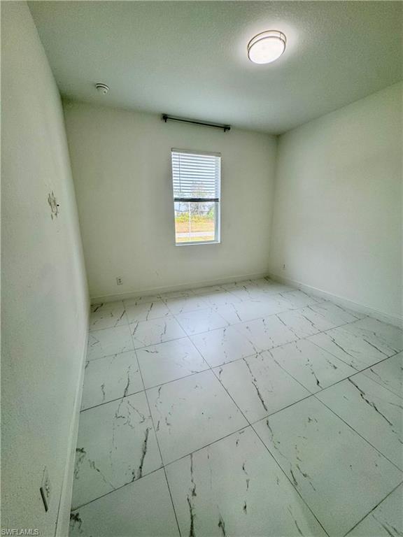 3743 Kenyon Street Fort Myers, FL 33905 - Photo 14 of 18 an empty room with a window