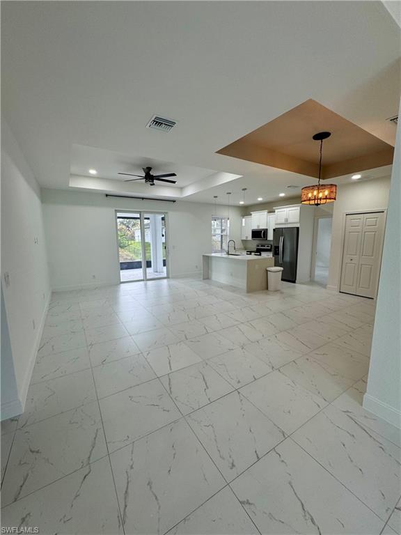3743 Kenyon Street Fort Myers, FL 33905 - Photo 2 of 18 a view of a hallway with a table and chairs