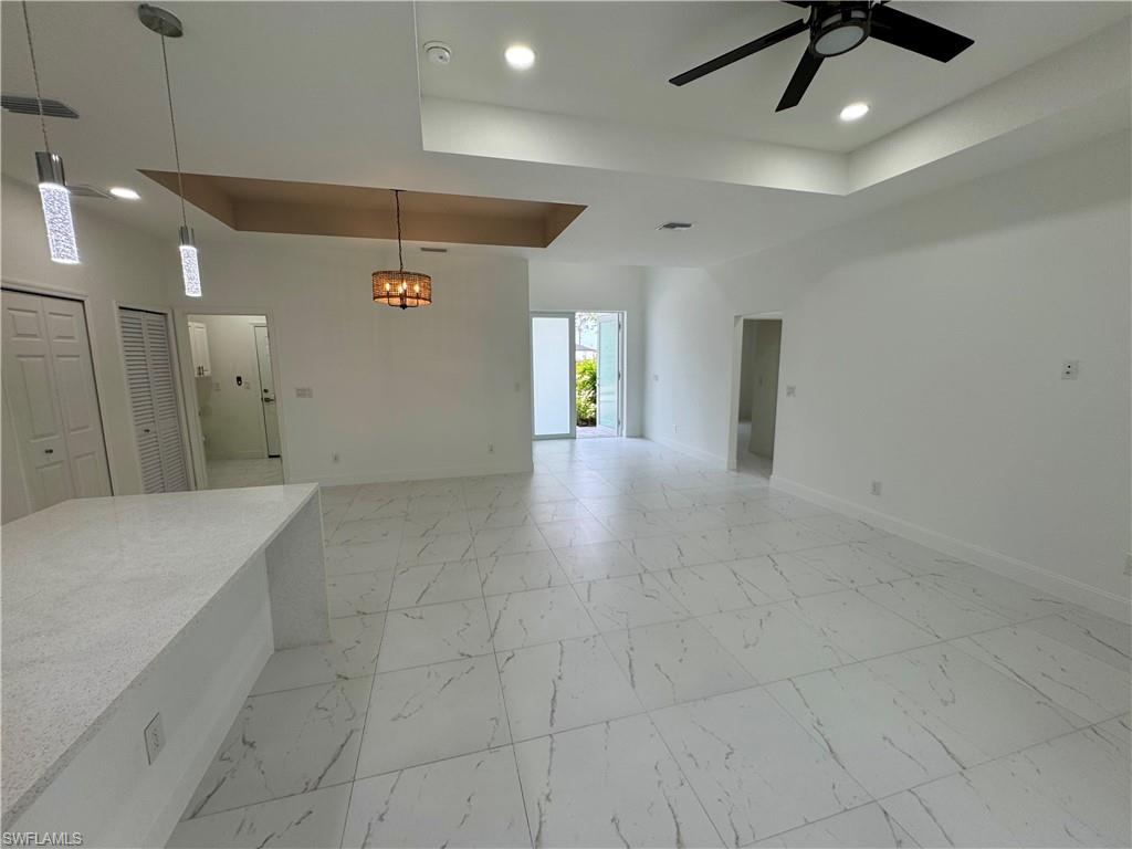 3743 Kenyon Street Fort Myers, FL 33905 - Photo 6 of 18 a view of hallway with a window and a chandelier