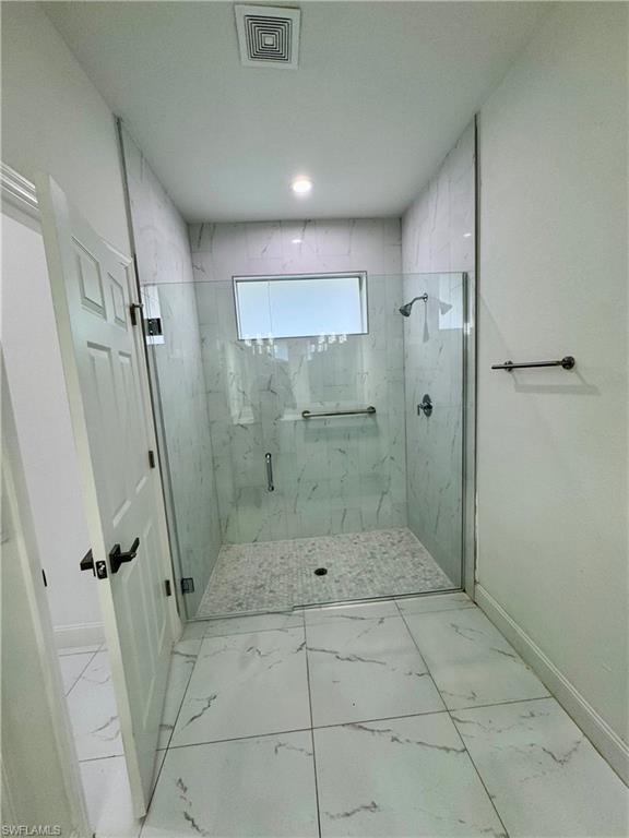 3743 Kenyon Street Fort Myers, FL 33905 - Photo 9 of 18 a bathroom with a shower