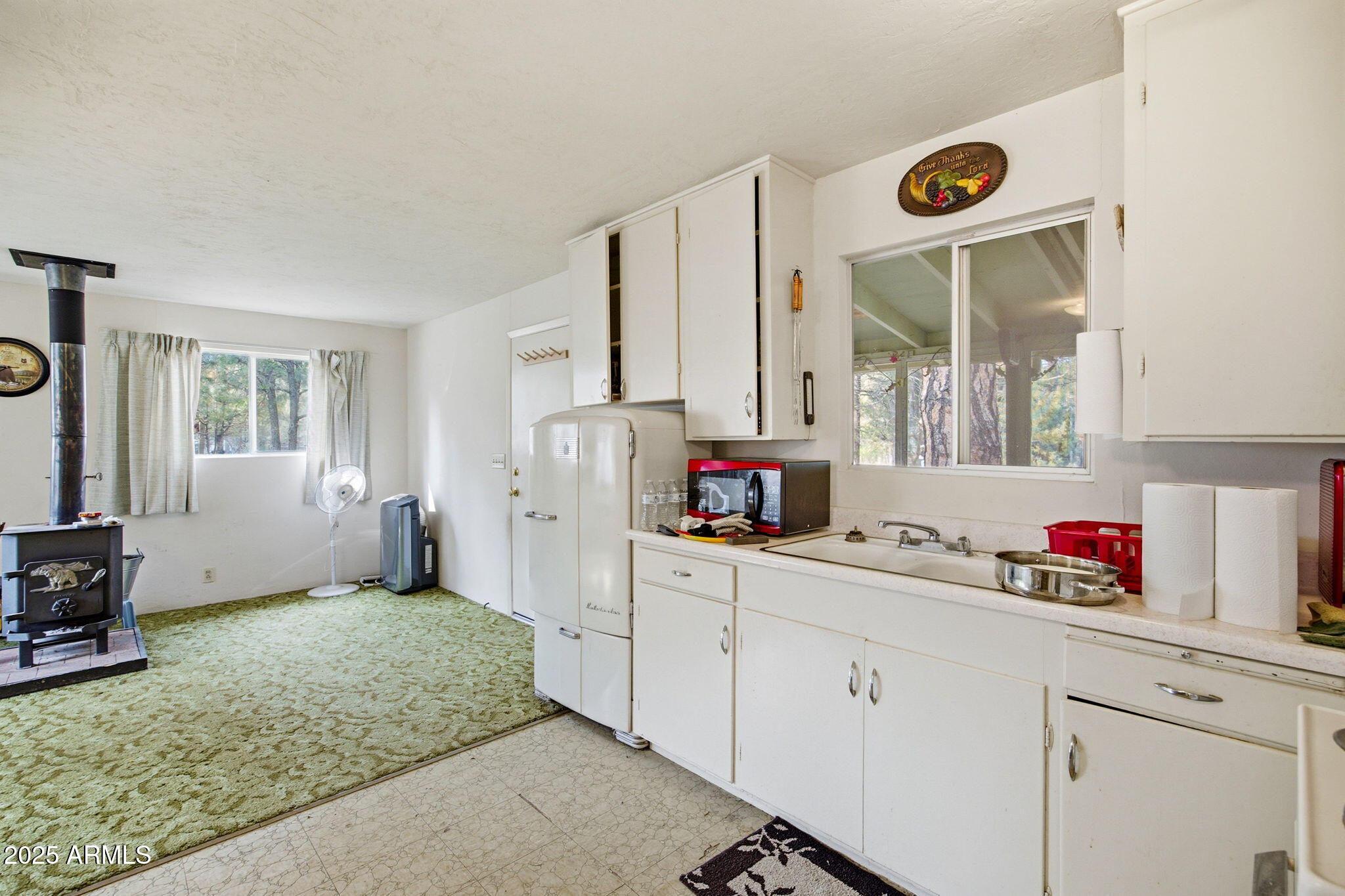 2887 Center Road Overgaard, AZ 85933 - Photo 11 of 31 a kitchen with a sink cabinets and window