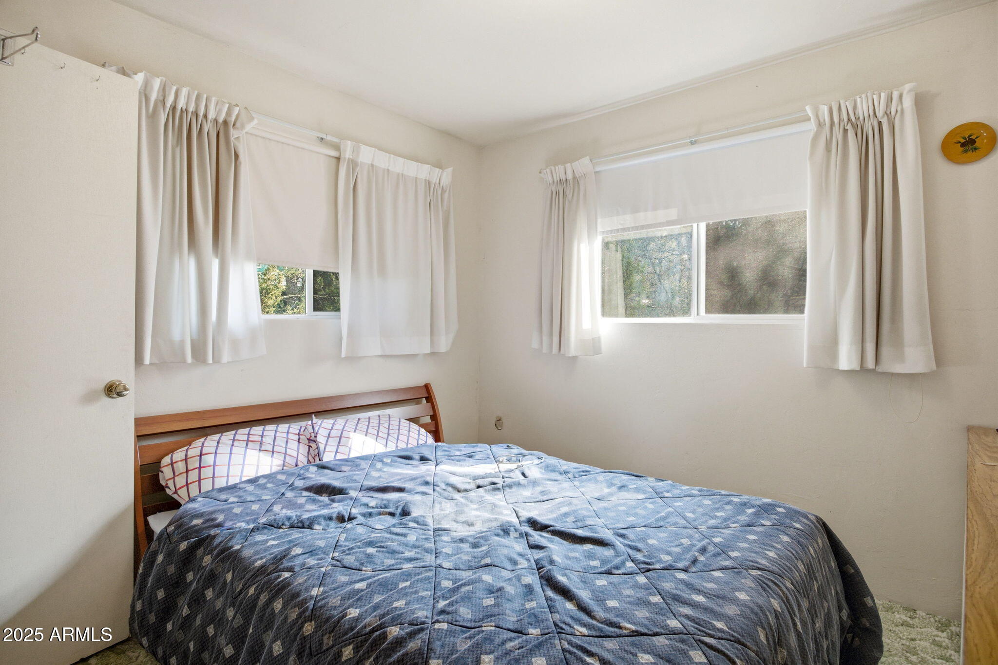 2887 Center Road Overgaard, AZ 85933 - Photo 13 of 31 a bedroom with a bed and window
