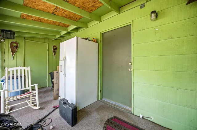 a room with gym equipment and a window