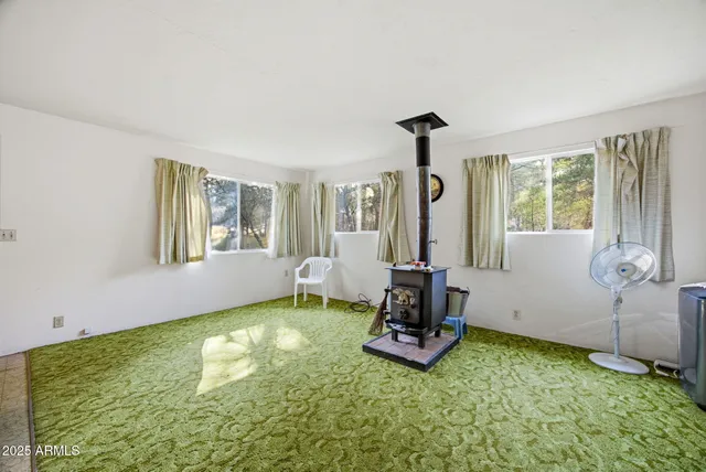a utility room with cabinets washer and dryer