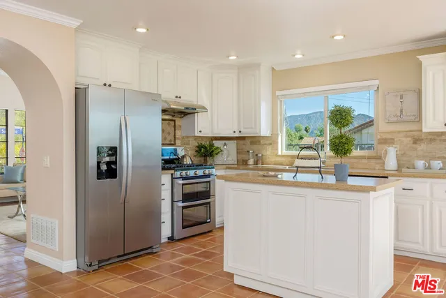 a living room with fireplace furniture and a fireplace