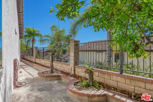 a large white kitchen with cabinets and stainless steel appliances