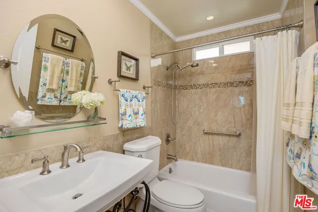 an empty room with wooden floor and closet