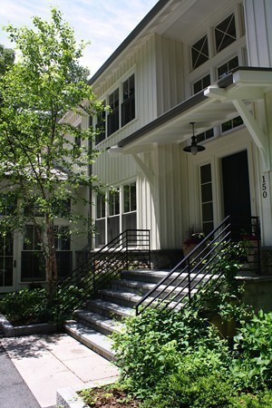 150 Meadowbrook Road Weston, MA 02493 - Photo 8 of 27 a front view of a house with a yard