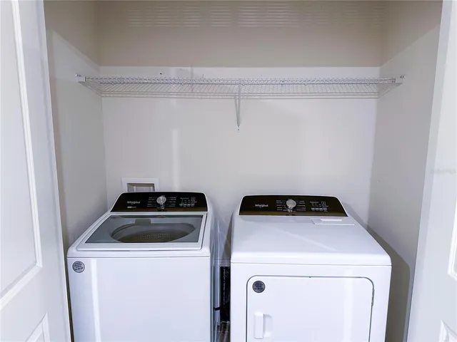 a utility room with dryer and washer