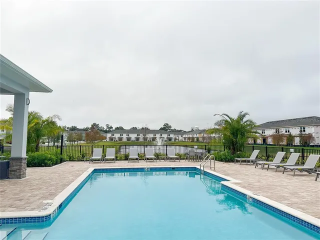 a view of swimming pool from a balcony