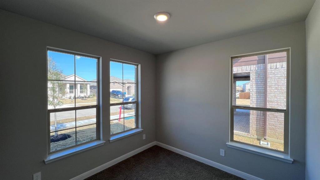 138 Stanton Avenue Rhome, TX 76078 - Photo 10 of 19 an empty room with windows