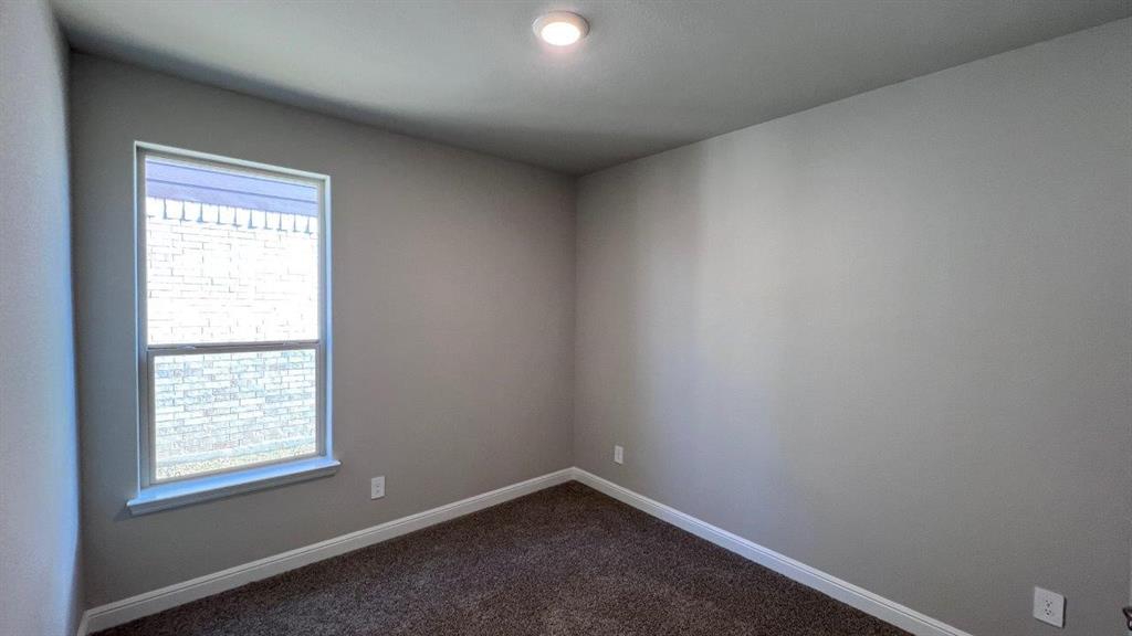138 Stanton Avenue Rhome, TX 76078 - Photo 12 of 19 an empty room with a window
