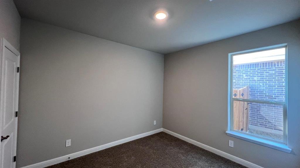 138 Stanton Avenue Rhome, TX 76078 - Photo 13 of 19 an empty room with a window
