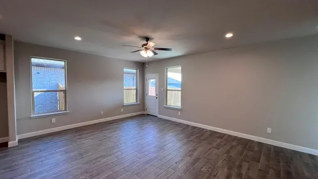a view of kitchen with sink and refrigerator
