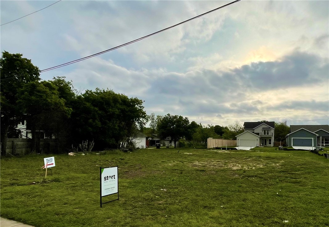 a view of a golf course with chairs