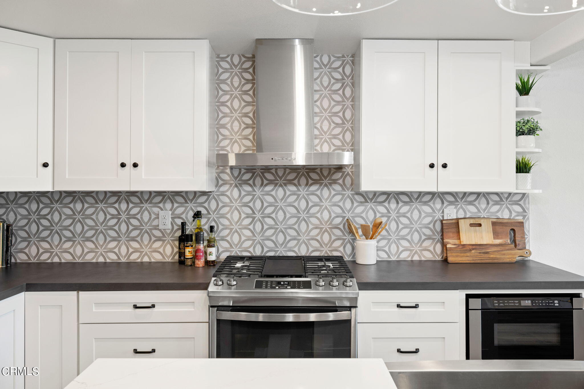 3421 Sunset Lane Oxnard, CA 93035 - Photo 24 of 59 a kitchen with granite countertop white cabinets and white appliances