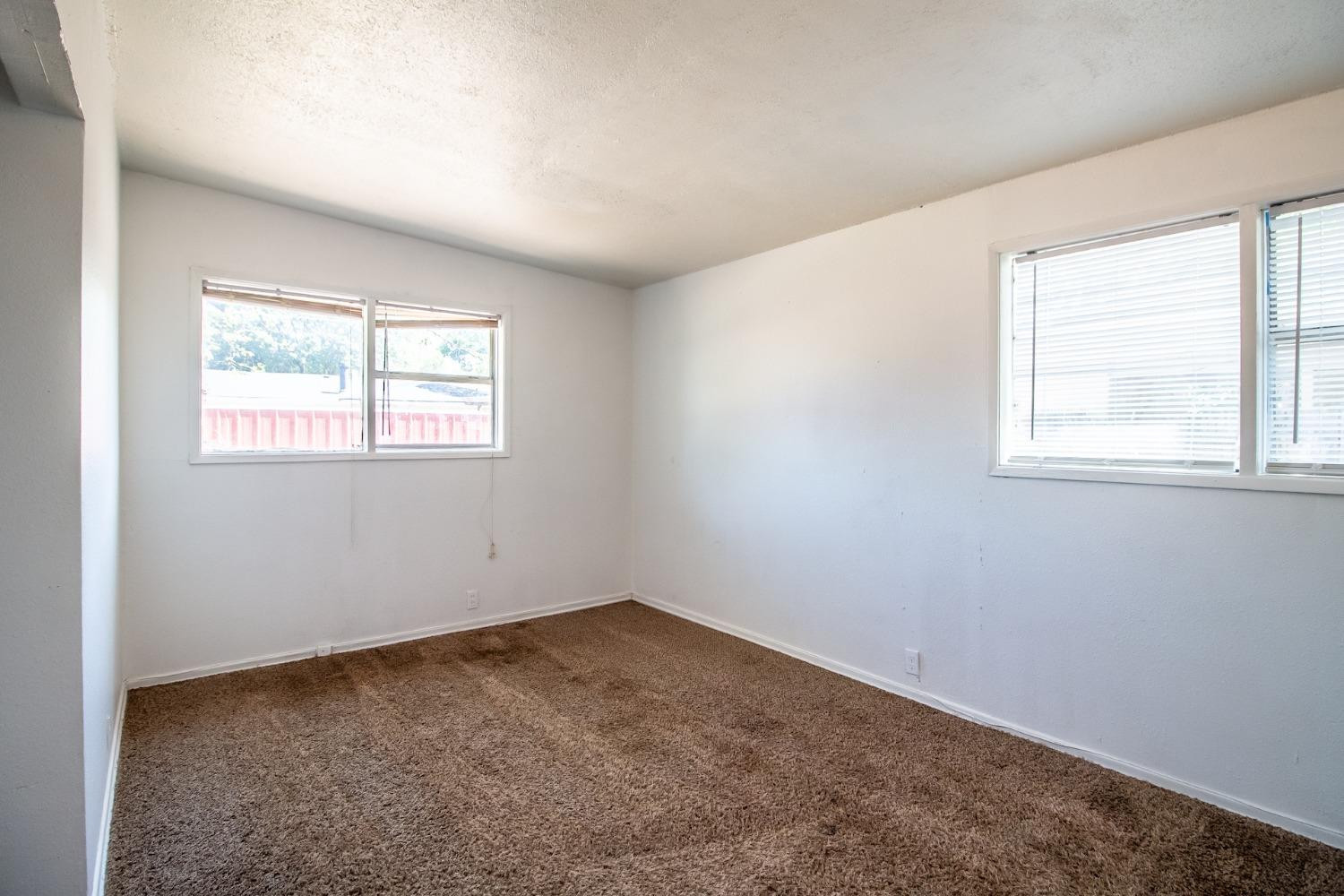2714 62nd Street Lubbock, TX 79413 - Photo 18 of 28 an empty room with windows