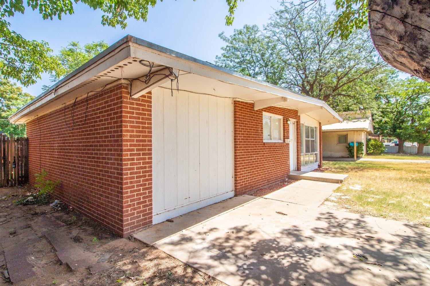 2714 62nd Street Lubbock, TX 79413 - Photo 5 of 28 a view of a house with a backyard