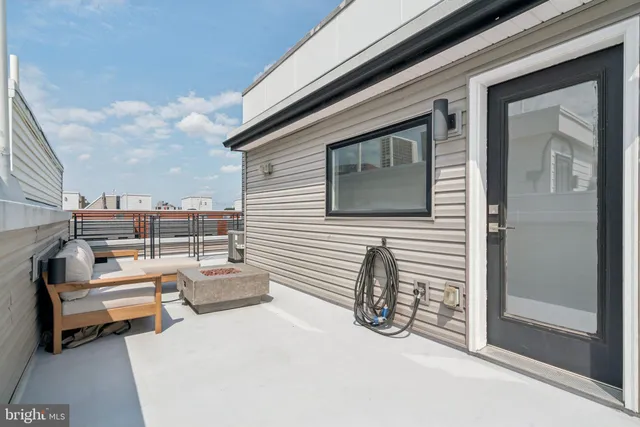 a balcony with furniture and a terrace view