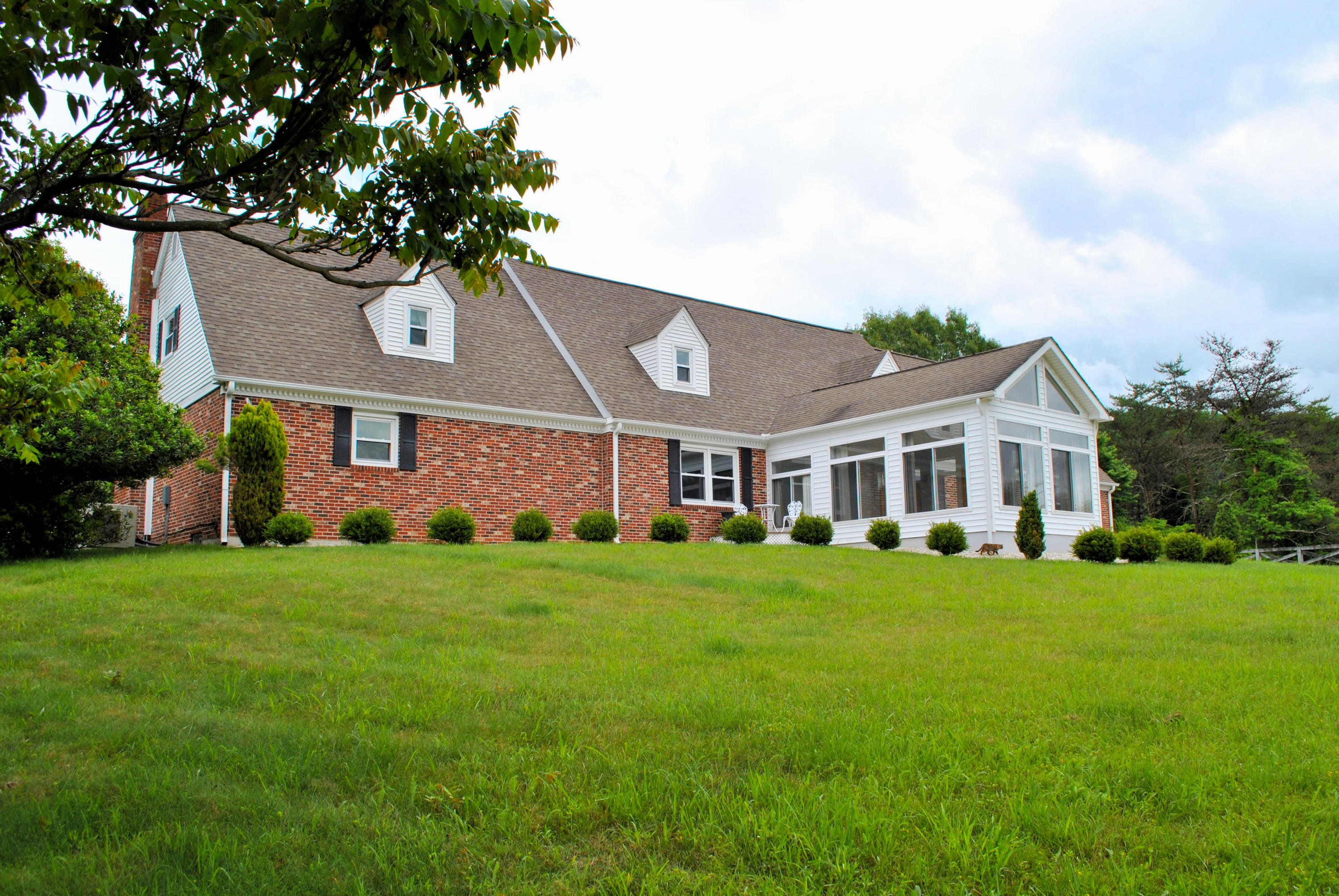 240 Fawn Lane Riner, VA 24149 - Photo 2 of 95 a front view of a house with a garden